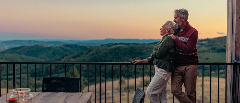 retired couple enjoying the sunset